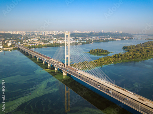 South bridge in Kiev. Algae bloom in the water of the Dnieper River. Aerial drone view.