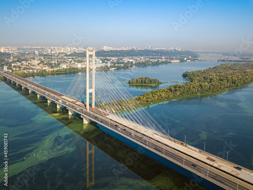 South bridge in Kiev. Algae bloom in the water of the Dnieper River. Aerial drone view.