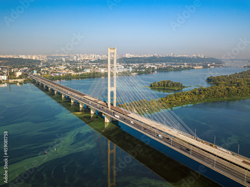 South bridge in Kiev. Algae bloom in the water of the Dnieper River. Aerial drone view.