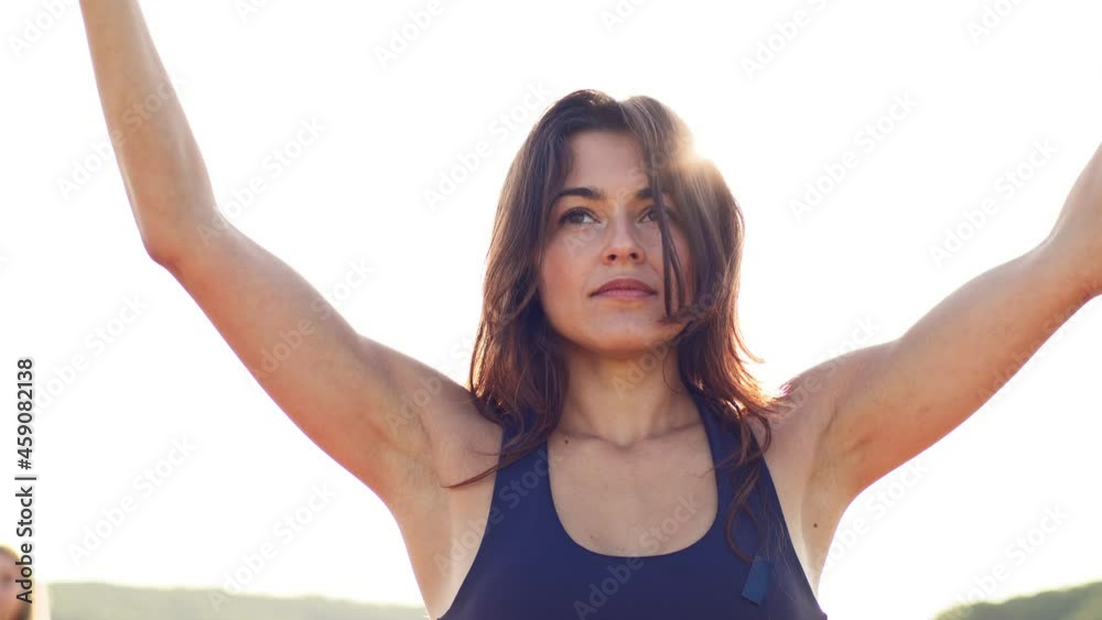 Young caucasian sporty attractive female practicing yoga tree pose. Group of women exercising and stretching. Healthy lifestyle. Young caucasian sporty attractive female practicing yoga tree pose. Group of women exercising and stretching. Healthy lifestyle.