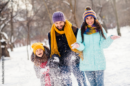 Photo of excited family happy positive smile mommy daddy daughter have fun playful snowy walk park free time #459083529