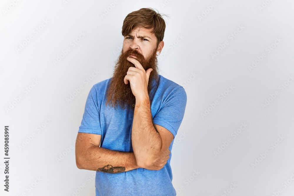 Caucasian man with long bear standing over isolated background looking confident at the camera smiling with crossed arms and hand raised on chin. thinking positive. Caucasian man with long bear standing over isolated background looking confident at the camera smiling with crossed arms and hand raised on chin. thinking positive.