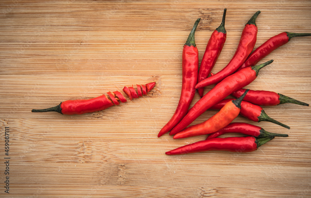 red hot chili peppers on wooden background red hot chili peppers on wooden background