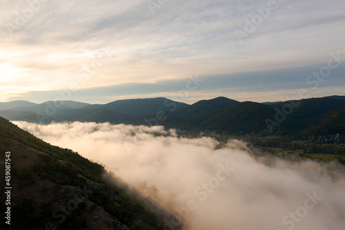 Foggy morning over the Danube river in Hugary. This photo made in Danube bend near by Esztergom city. Amazing landscape with haze.