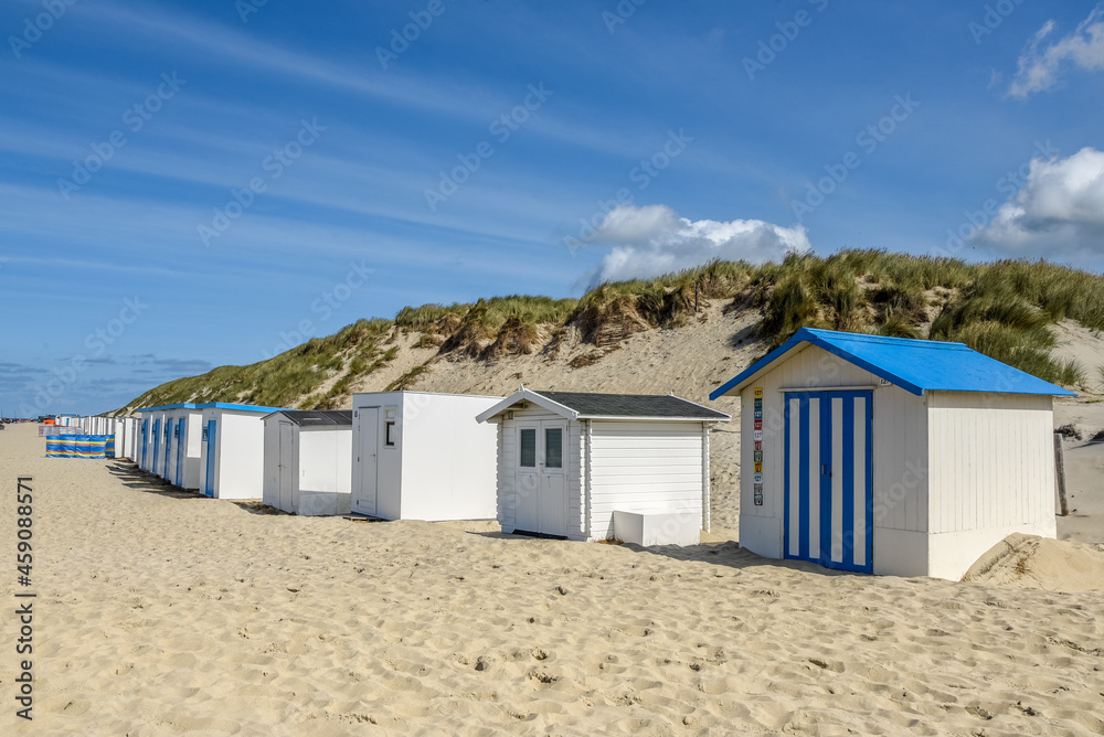 Texel, Netherlands. August 2021. The beach houses on the beach of the Wadden Island of Texel. Texel, Netherlands. August 2021. The beach houses on the beach of the Wadden Island of Texel.