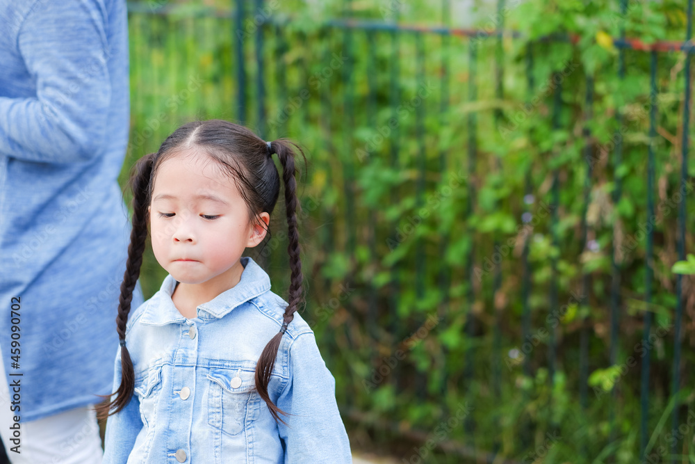 Portrait asian little cute girl unhappy in playground Portrait asian little cute girl unhappy in playground