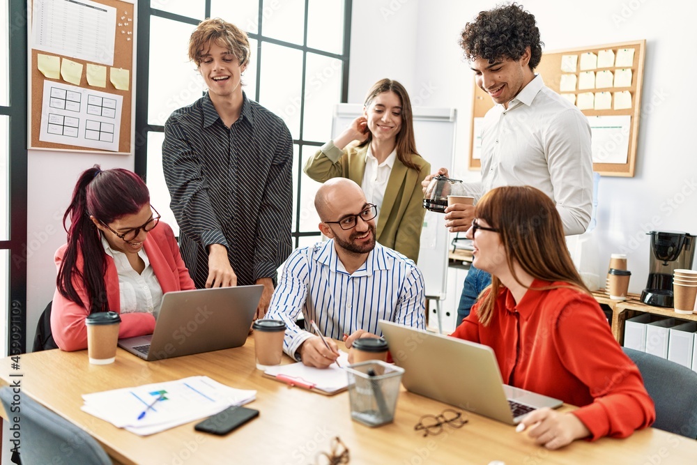 Fototapeta premium Group of business workers smiling happy working at the office.