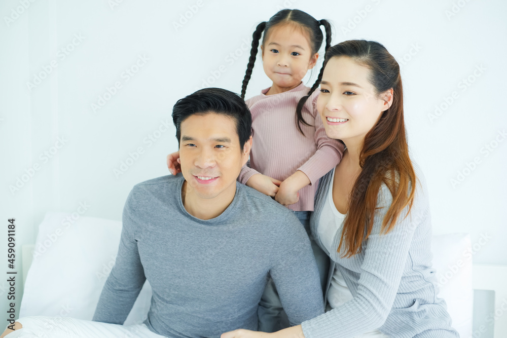 Happy asian family, father mother and daughter together in room Happy asian family, father mother and daughter together in room