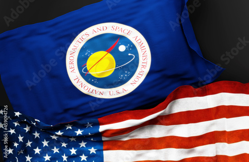 Flag of the United States National Aeronautics and Space Administration along with a flag of the United States of America as a symbol of a connection between them, 3d illustration