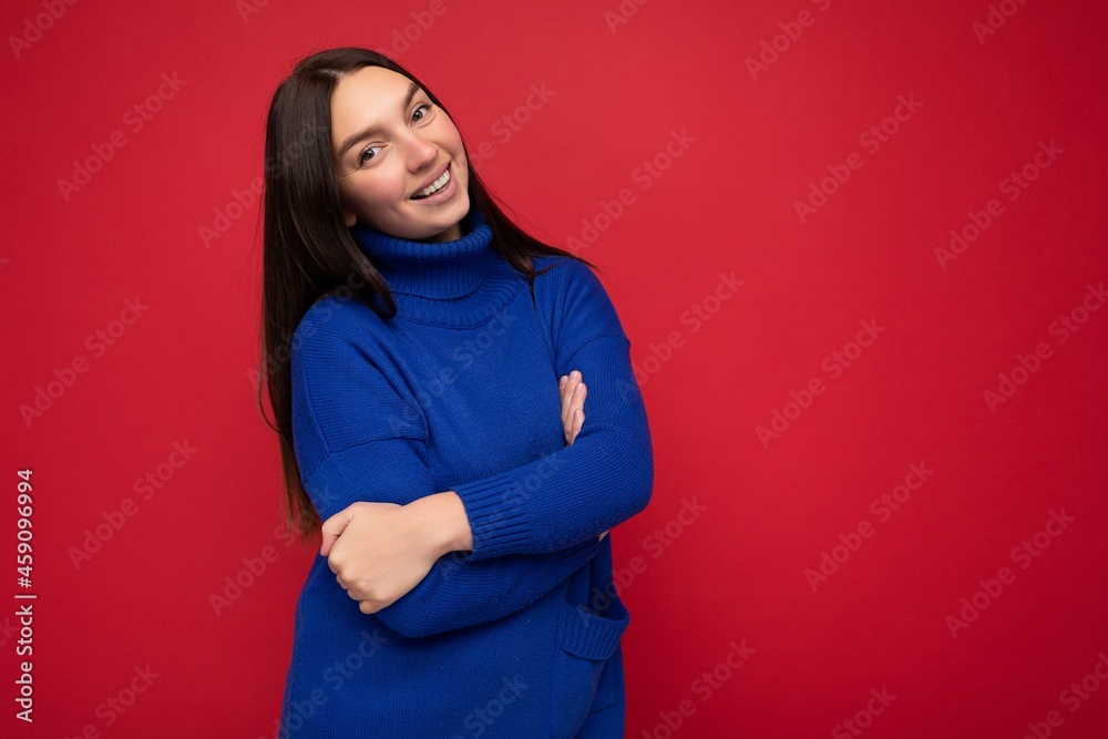 Fototapeta premium Photo of beautiful positive smiling adult woman wearing stylish clothes standing isolated on colorful background with copy space looking at camera