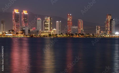 Izmir  Turkey - September 21  2021  Night view from the sea of the new skyscrapers district of Izmir city. Izmir is Turkey s third largest city.