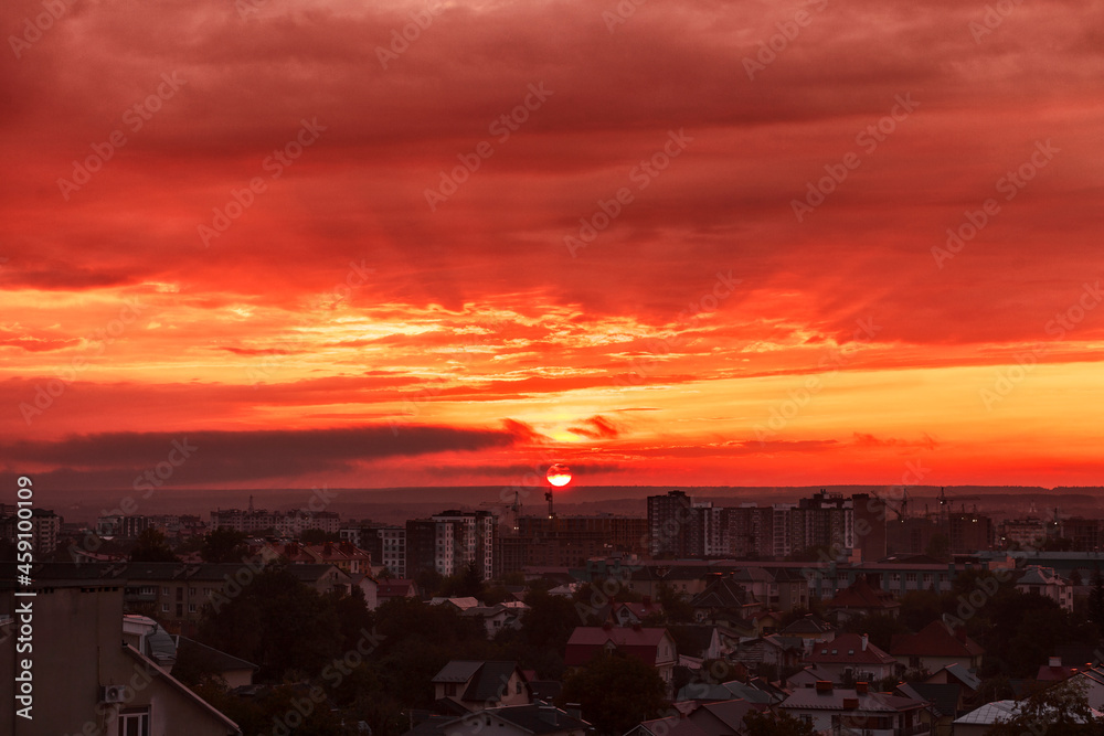 Wonderful sunset on a cloudy sky in the city
