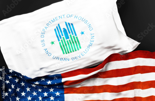 Flag of the United States Department of Housing and Urban Development along with a flag of the United States of America as a symbol of a connection between them, 3d illustration