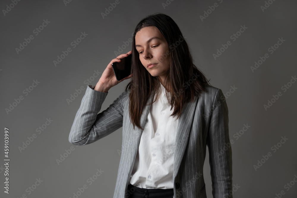 businesswoman dressed in a jacket and trousers in a casual style businesswoman dressed in a jacket and trousers in a casual style