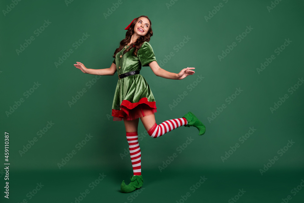 Full length body size view of attractive cheerful girl elf dancing rest good mood isolated over green color background