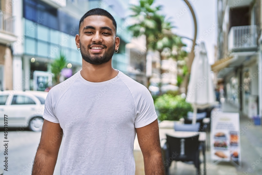 Young middle east man smiling happy standing at the city. Young middle east man smiling happy standing at the city.