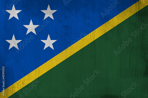 Patriotic wooden background in color of Solomon Islands flag