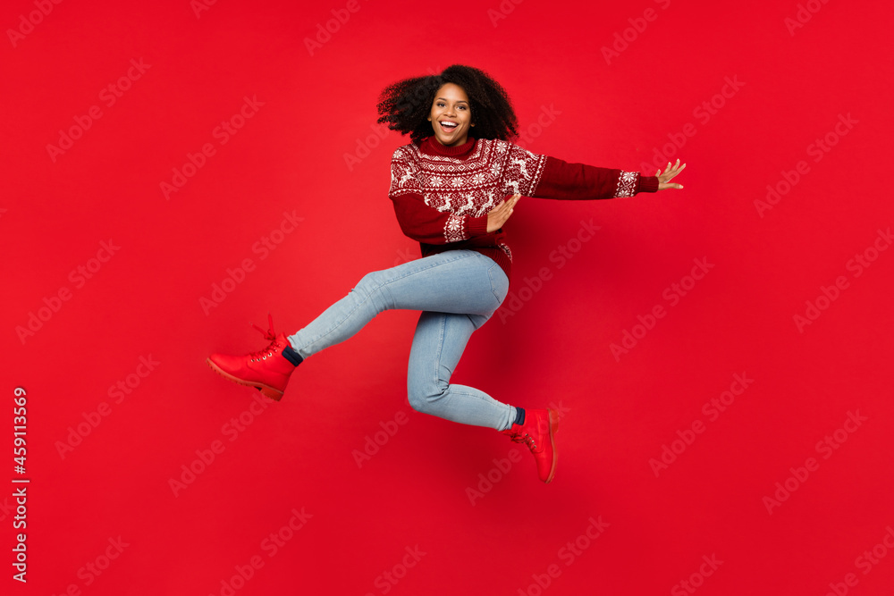 Full length body size view of attractive cheerful girl jumping having fun dancing isolated over shine red color background Full length body size view of attractive cheerful girl jumping having fun dancing isolated over shine red color background