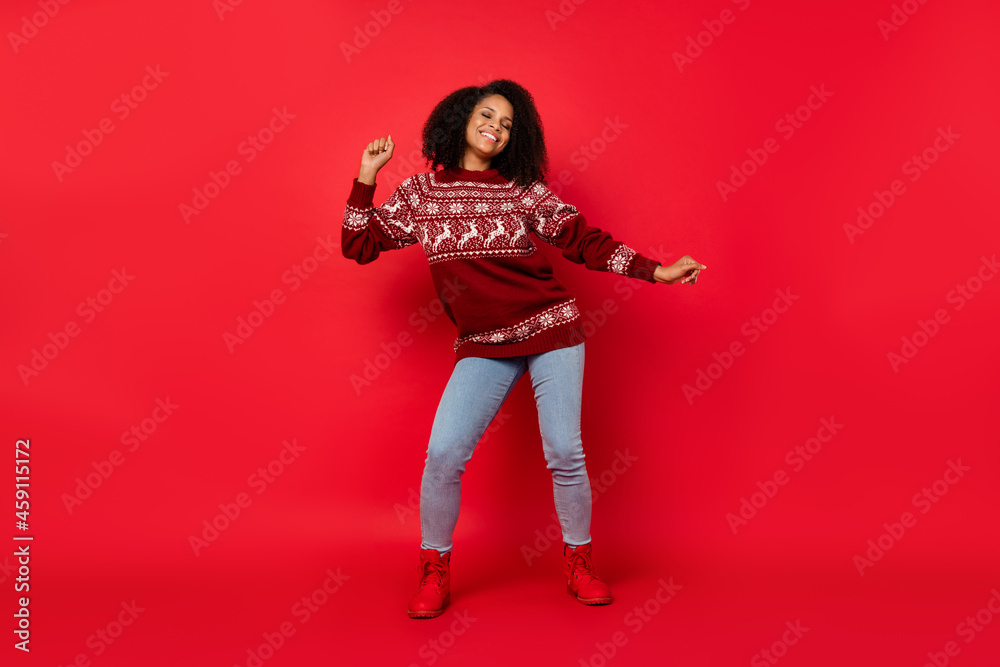 Full length body size photo woman smiling chilling dancing at xmas party isolated bright red color background Full length body size photo woman smiling chilling dancing at xmas party isolated bright red color background