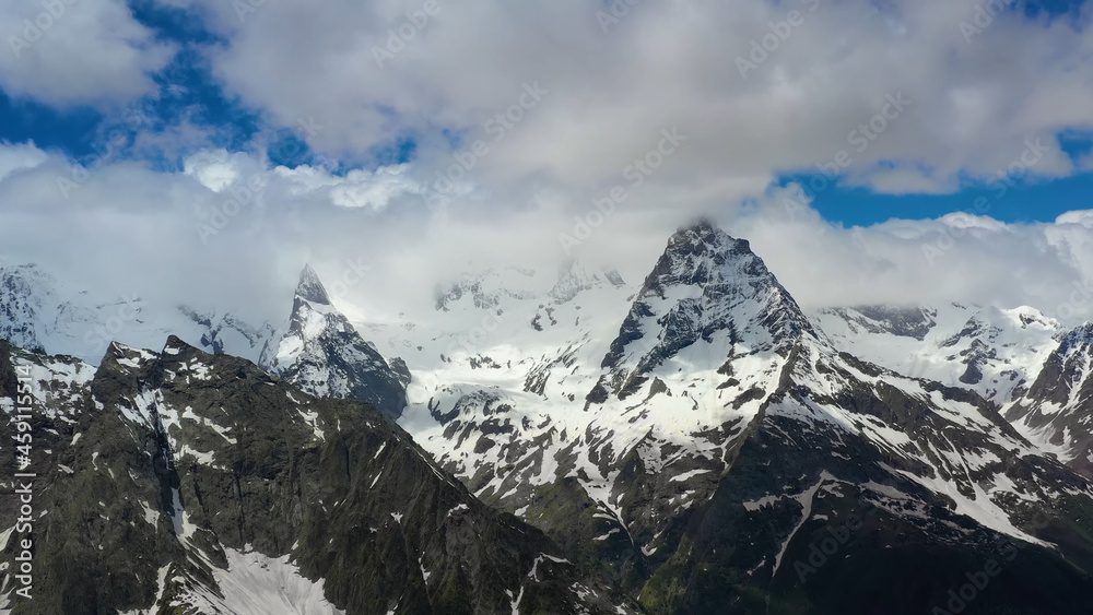 Obraz premium View from afar to the top of the mountain, clouds, majestic landscape, stock photo