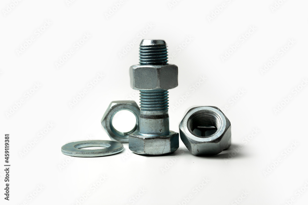 several large bolts and nuts on a white background several large bolts and nuts on a white background