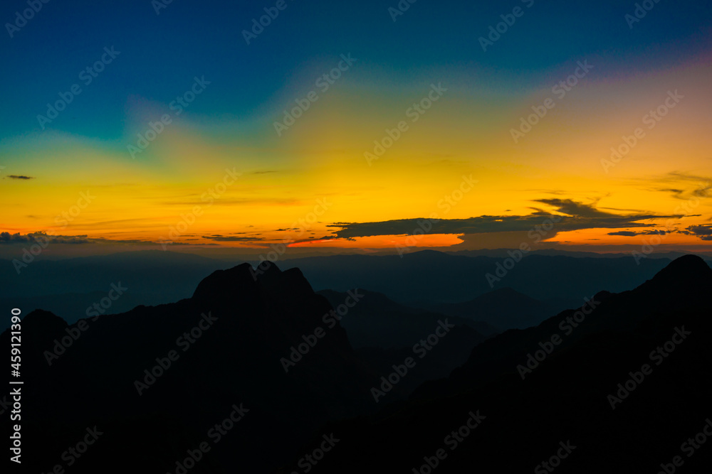 Sunset sky with cloud on top of mountain