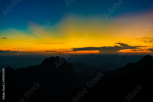 Sunset sky with cloud on top of mountain