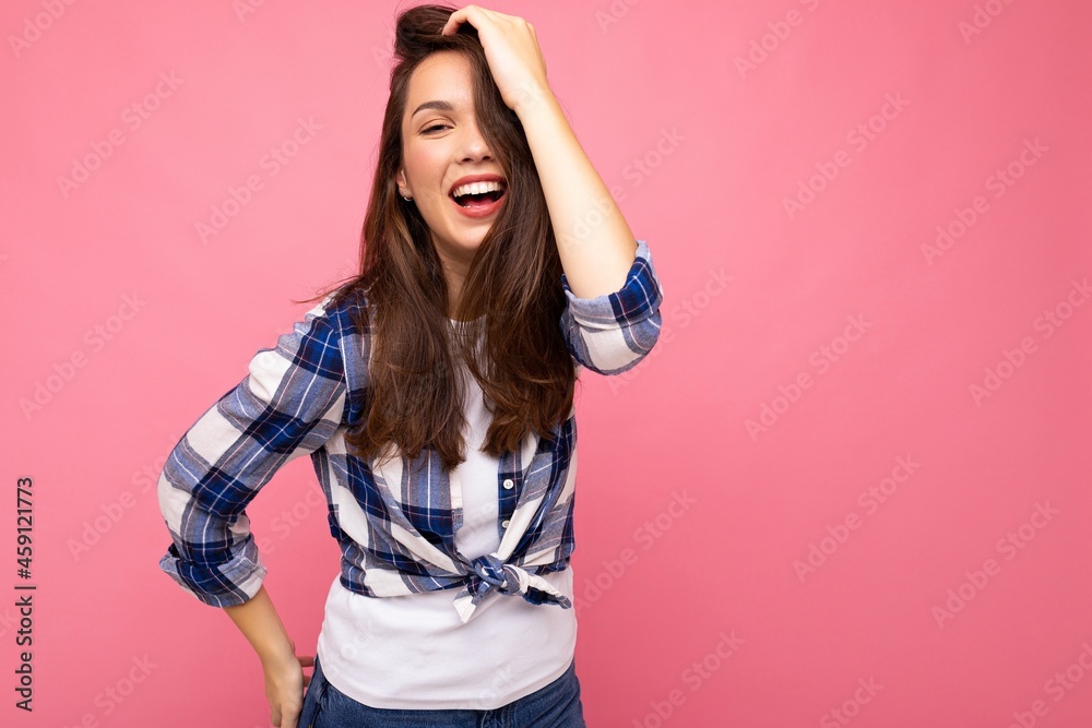 Young beautiful brunet woman. Trendy lady in casual summer hipster shirt . Positive female shows facial sincere emotions. Funny model isolated on pink background with free space Young beautiful brunet woman. Trendy lady in casual summer hipster shirt . Positive female shows facial sincere emotions. Funny model isolated on pink background with free space