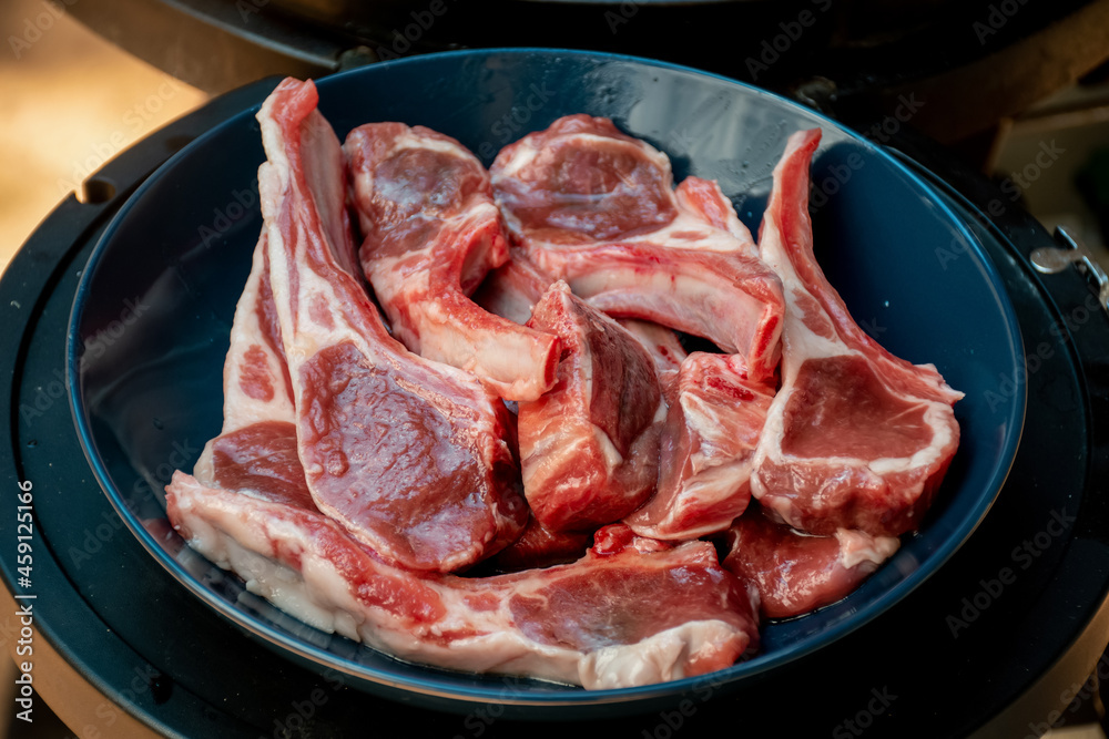 Raw lamb cutlets ready for barbecue grill. Backyard BBQ cooking. Australia Day celebration
