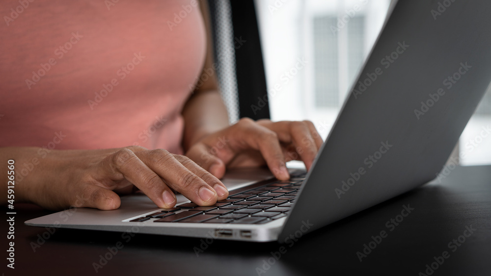 Businessman hands pressing laptop keyboard to work at home on tax finances Businessman hands pressing laptop keyboard to work at home on tax finances