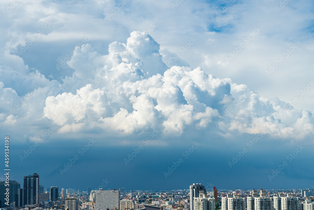 City buildings with cloud, blue sky and copy space