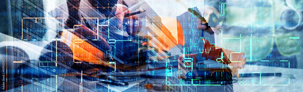 Obraz premium Two colleagues discussing data working and tablet, laptop with on on architectural project at construction site at desk in office