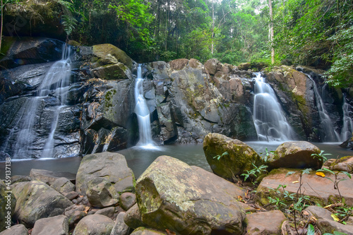 Long exposure shot of waterfall in the forest at Spun or Span Nan province, Northern Thailand.