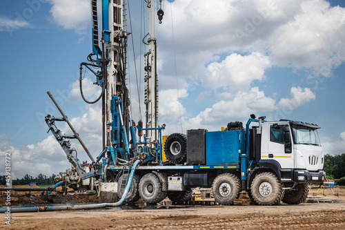 Картината върху платно The drilling rig close-up is drilling a well against the background of the cloudy sky