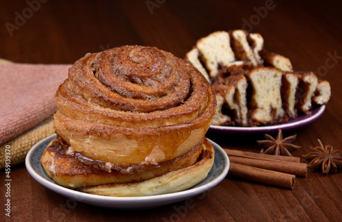 Cinnamon rolls sweet pastry with spices on the table stock images. Delicious fresh cinnamon bun still life stock photo