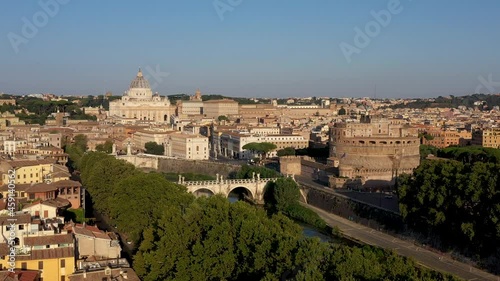 ROME AND VATICAN CITY, ITALY - 10 SEPTEMBER 2021: Title: Aerial view St. Peter's cathedral and Saint Angelo Castle  in Rome, Italy during a sunny day. Establishment Shot from above photo