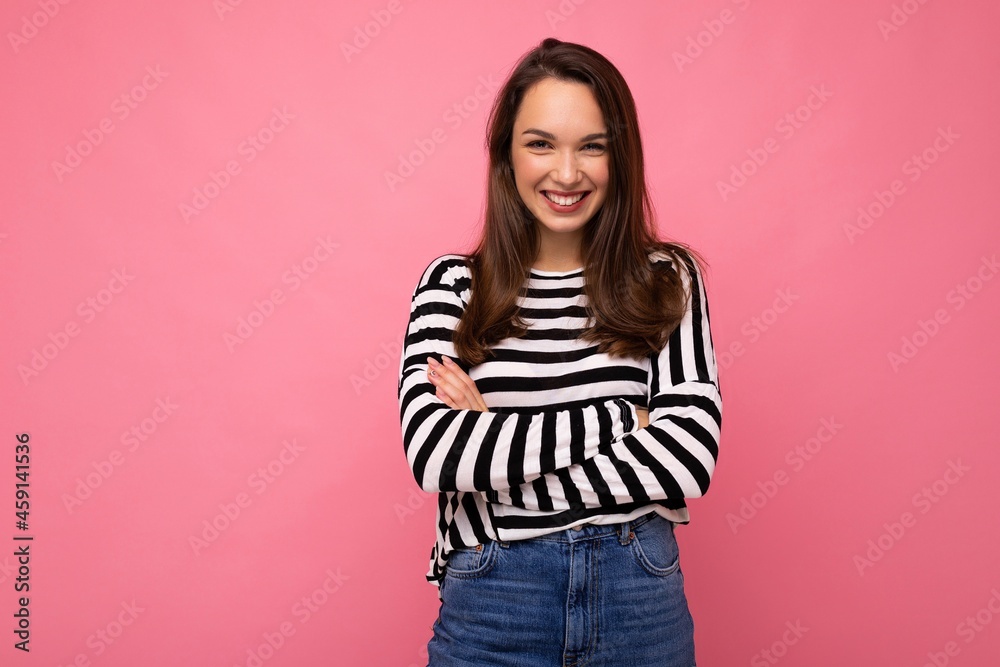 Portrait of positive cheerful fashionable woman in casual clothes isolated on pink background with copy space Portrait of positive cheerful fashionable woman in casual clothes isolated on pink background with copy space