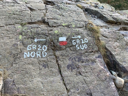 sign on a stone wall photo