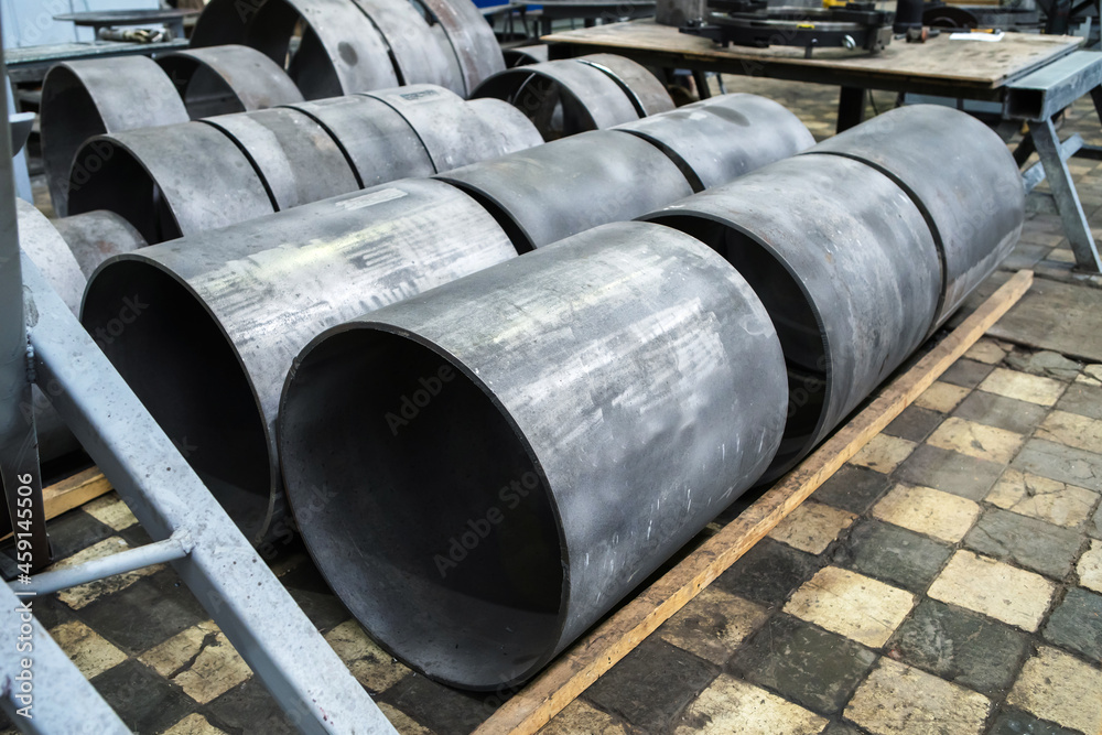 Warehouse of metal pipes at a metallurgical plant. Close-up Warehouse of metal pipes at a metallurgical plant. Close-up