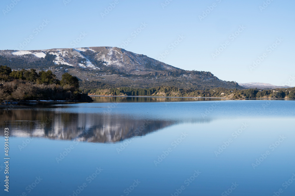 Beauty in nature. Alpine landscape. The mountains, forest and blue sky reflection in the lake. 