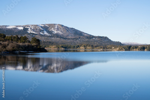 Beauty in nature. Alpine landscape. The mountains, forest and blue sky reflection in the lake. 