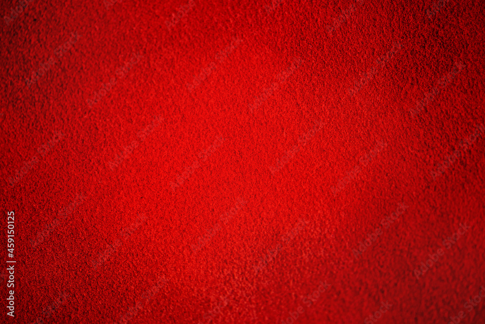 Fototapeta premium Natural leather of red color. Suede as a background.