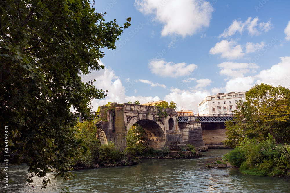 Along the banks of the Tiber River in Rome. Ancient bridges Along the banks of the Tiber River in Rome. Ancient bridges