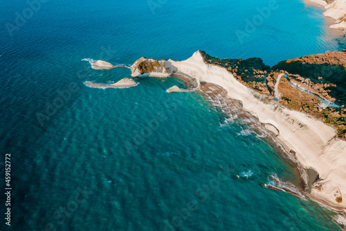 Aerial drone view to clear blue sea or ocean water. Amazing azure nature background. Clean light coast, travel destination.