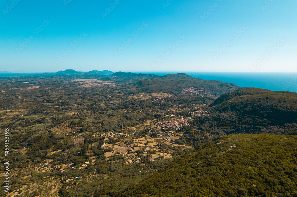 Aerial drone view. Camera above beautiful summer landscape of south island in Europe. Mediterranean Ionian sea on horizon.