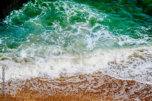 onde 01 - onde che si infrangono sulla spiaggia dorata photo