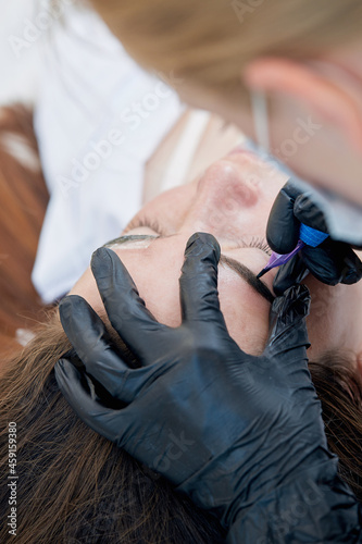 Permanent makeup. Tattooing of eyebrows