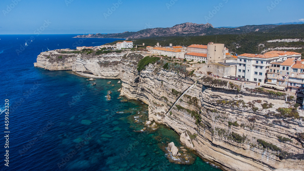 Aerial view of the cliffs of Bonifacio in the south of the island of Corsica in France - Medieval city built on the edge of a rocky promontory overlooking the Mediterranean Sea