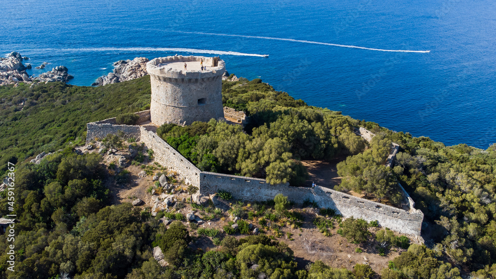 Aerial view of the ruins of the Genoese tower on Campomoro Cape in the South of Corsica, France - Torra di Campumoru surrounded by walls on a lookout above the Mediterranean Sea