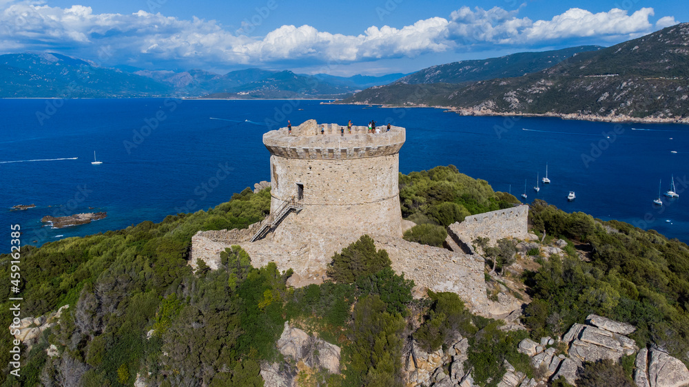 Aerial view of the ruins of the Genoese tower on Campomoro Cape in the South of Corsica, France - Torra di Campumoru surrounded by walls on a lookout above the Mediterranean Sea